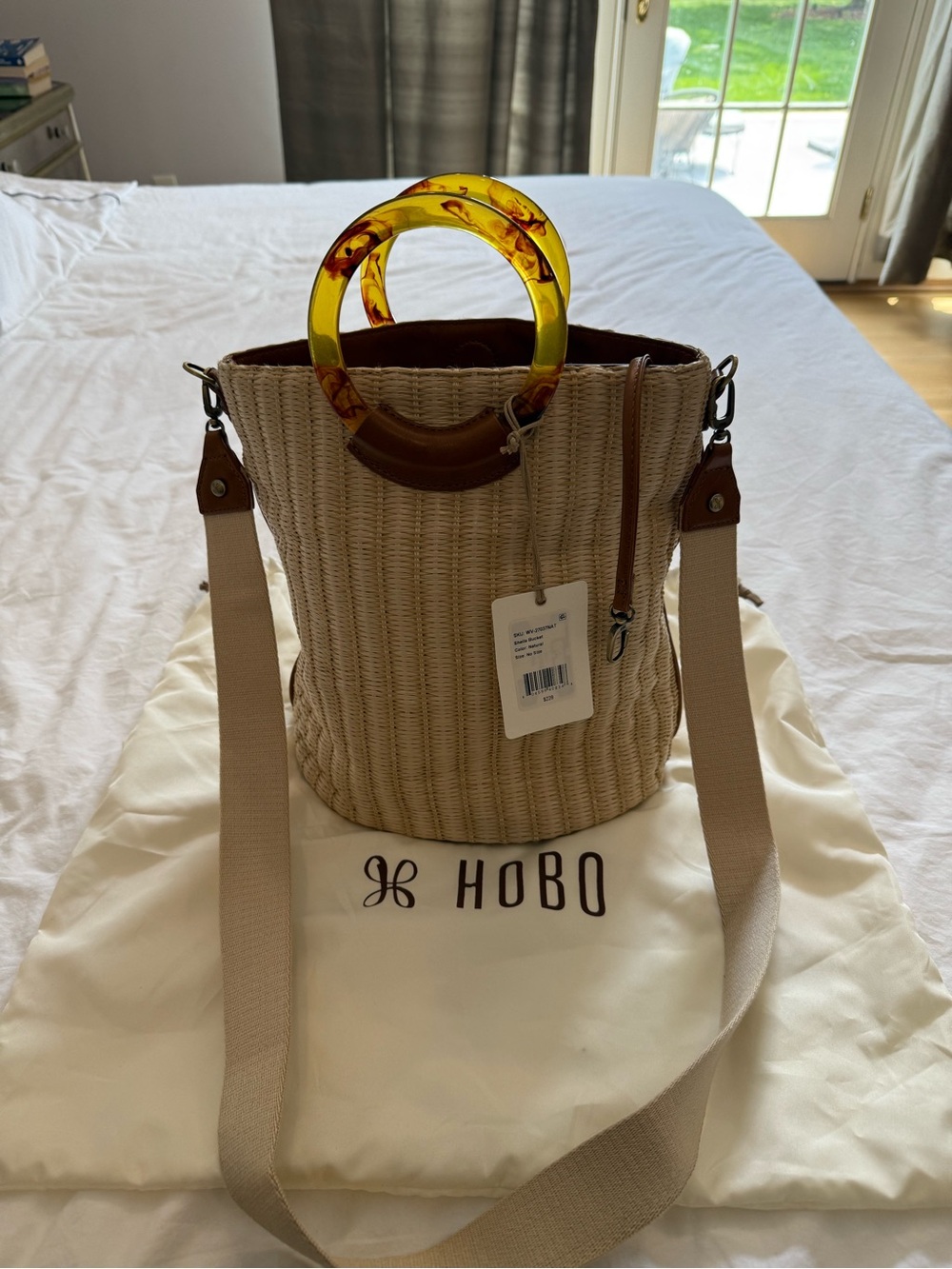 HOBO Straw Bucket Bag with Amber Resin Ring Handles
